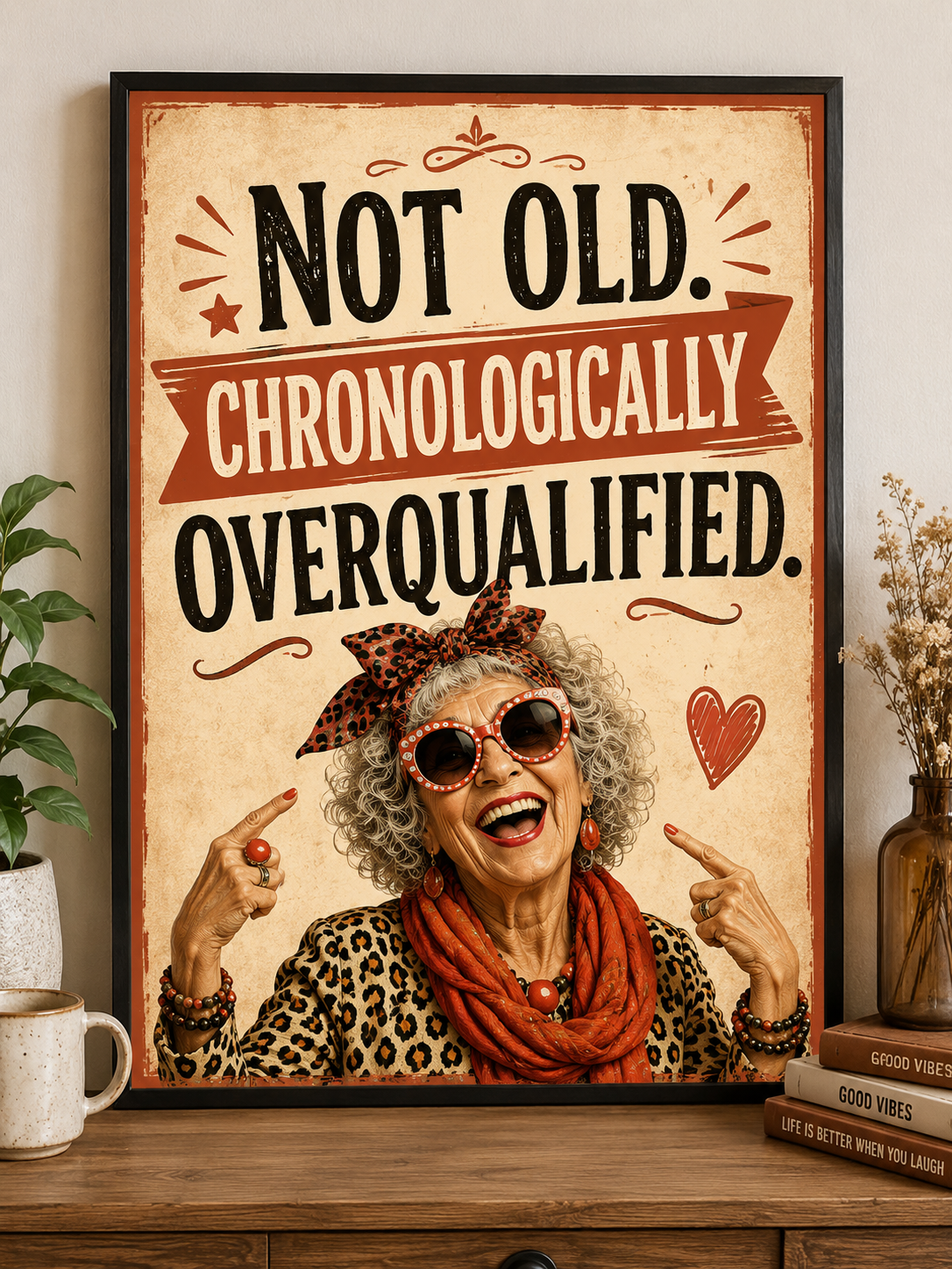 Funny wall print saying “Not Old. Chronologically Overqualified” with a stylish older character in the Laughing Through The Wrinkles style.