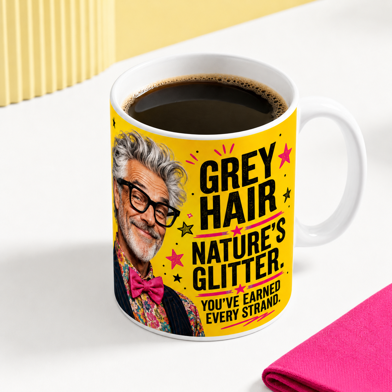 Grey Hair Nature’s Glitter funny mug for him filled with coffee, featuring a stylish silver-haired older man against a bold yellow, pink and black design.