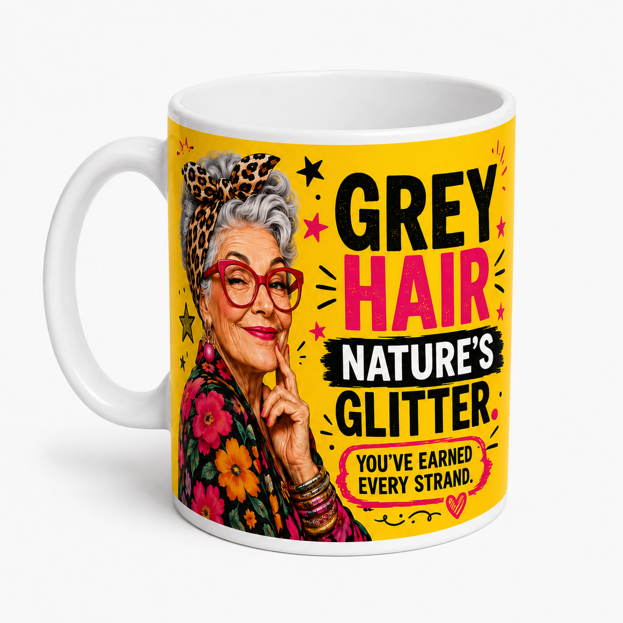 Left-handle view of the Grey Hair Nature’s Glitter funny ceramic mug, featuring a fabulous silver-haired woman and bold yellow, pink and black artwork.