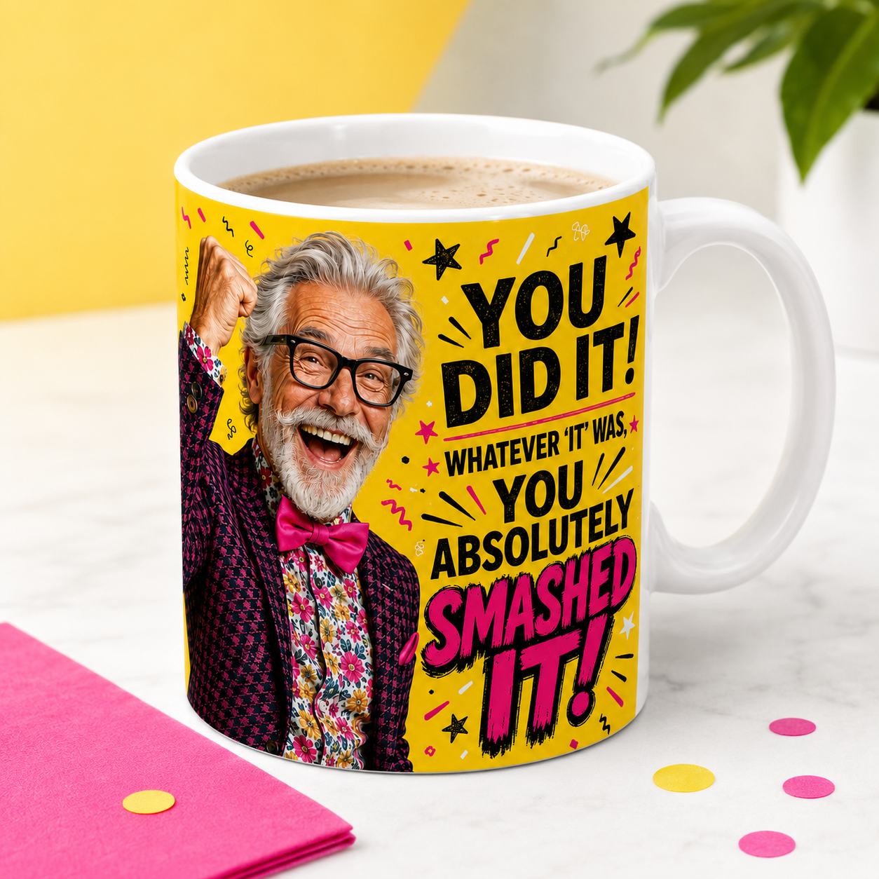 You Did It You Absolutely Smashed It celebration mug for him filled with coffee, featuring a jubilant silver-haired man with glasses, a raised fist and pink bow tie.
