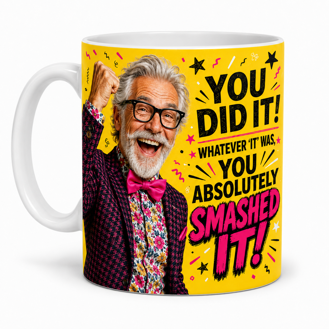 Left-handle view of the You Did It You Absolutely Smashed It celebration mug for him, featuring a jubilant silver-haired man with a raised fist and pink bow tie.